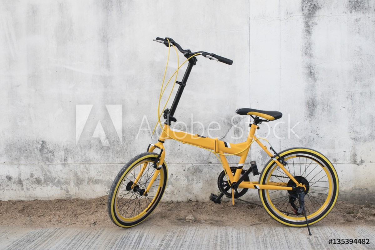 Picture of Yellow bicycle on wall background